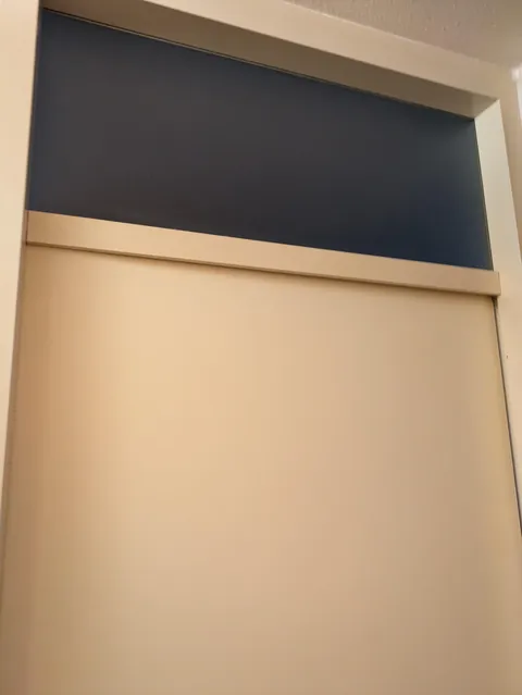 Bedroom door blocked from the inside with a fallen coffee table - what can i try?