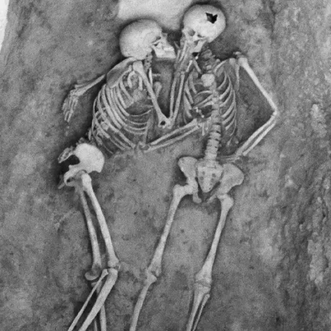 Two 6,000 year old skeletons kissing