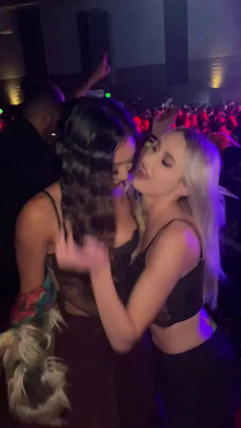 Girls kissing and licking in the club