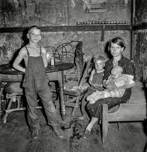 Coal miner's wife and three of their children. Company house in Pursglove, Scotts Run, West Virginia, September 1938.