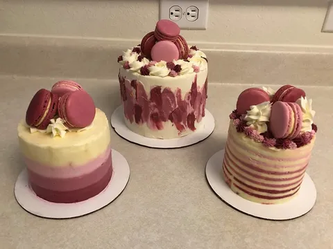 My sister made red velvet and cheesecake layered cakes with Italian meringue buttercream frosting and macarons.