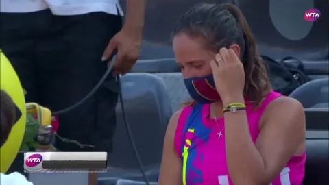 Tennis player Azarenka consoling her opponent after she twisted her ankle and forced to retire.