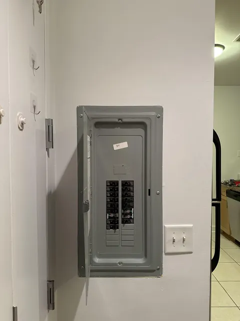 Safe to screw in a mounted coat rack above the circuit box?