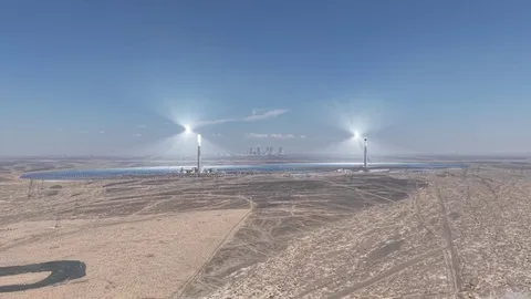 China's twin solar thermal towers. Molten salt stores the heat to produce electricity