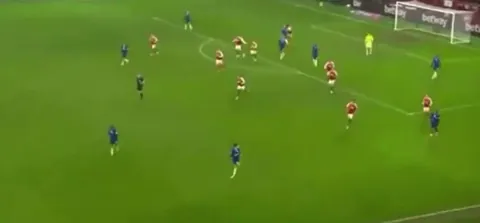 Chelsea manager Liam Rosenior tries to control the ball when it comes towards him on the volley