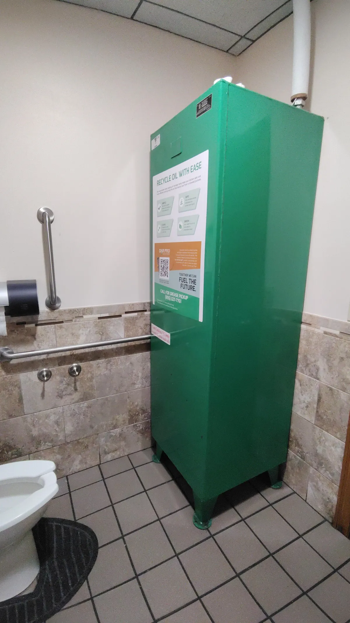 The used cooking oil at this restaurant is stored in the men's bathroom.