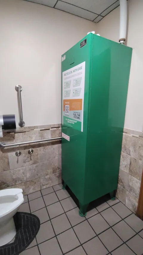 The used cooking oil at this restaurant is stored in the men's bathroom.