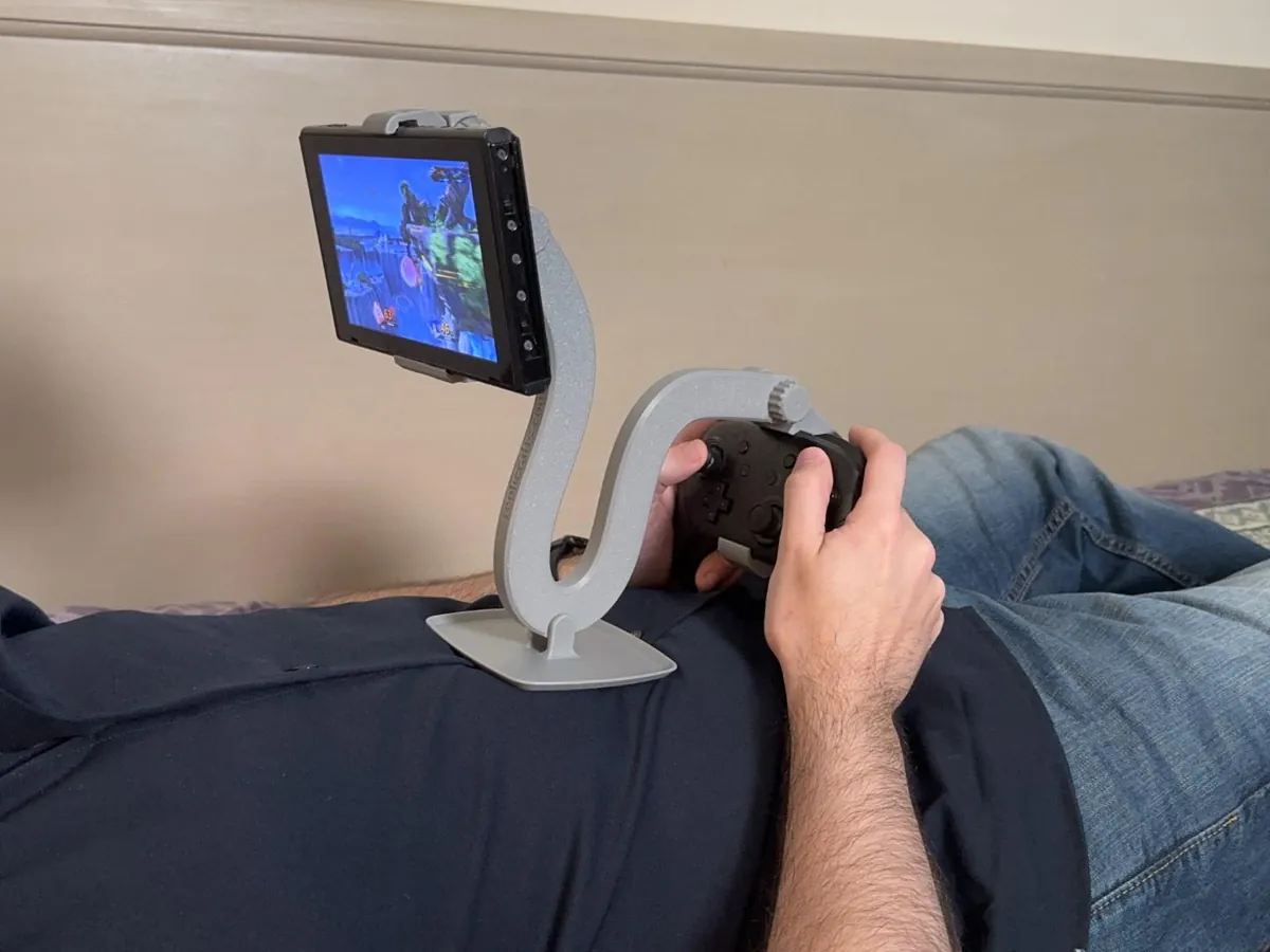 I started this a joke 3D print, but it became my favorite way to play with my Switch when I'm on my bed... I call it the Dragon Mount. Info in comments.