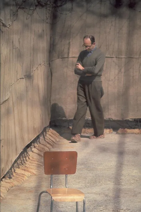 Adolf Eichmann walks around the yard of his cell, Ramla Prison, Israel, 1961