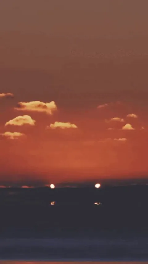 Fantastic video of partial solar eclipse at sunrise by Jason Kurth