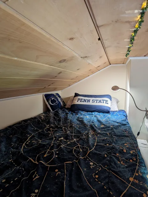 my chaotic/cozy bedroom loft