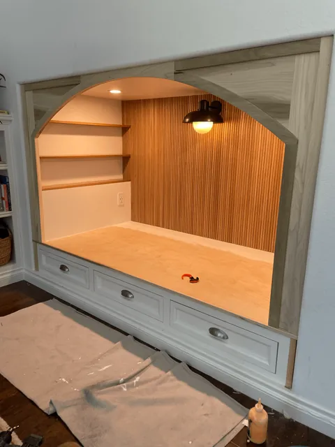 We transformed our 90s entertainment center in a reading nook