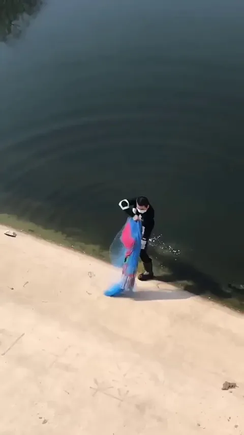 Perfect cast net throw mesmerizing spin in slow motion