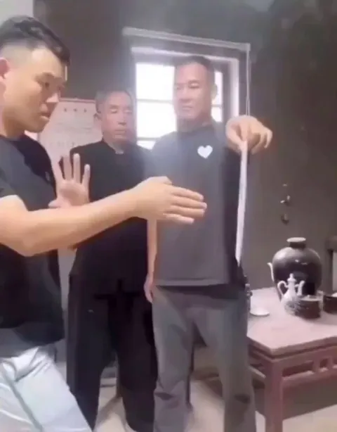 Master shows his student how to do the 1-inch-punch