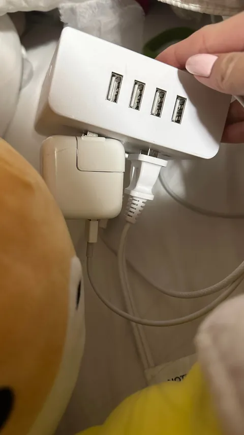 my sister doesn’t listen to me of the danger of half-plugged chargers in an extension outlet ON her bed