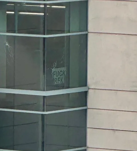 The windows on Building 18 at CDC headquarters, where an anti-vaxxer fired nearly 500 rounds