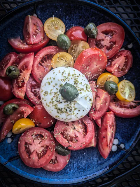 Burrata with 4 different homegrown tomatoes and marinated olives