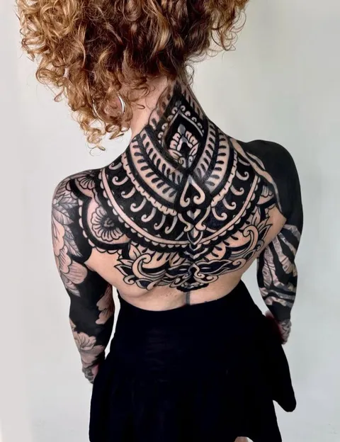 Ornamental back tattoo done by @federico.blcktattoo in Milan, Italy