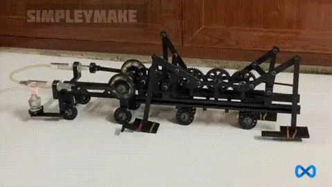 A 3D printed Stirling engine powered Chebyshev Lambda walking mechanism. 1:35 compound gear ratio and alcohol as fuel for engine