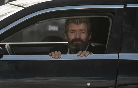 PsBattle: Hugh Jackman looking out of a car window