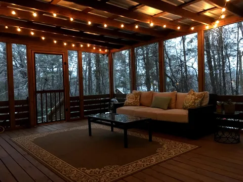 My back porch this morning while it was snowing.