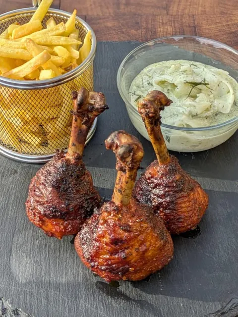 Lollipops with fries and cucumber salad