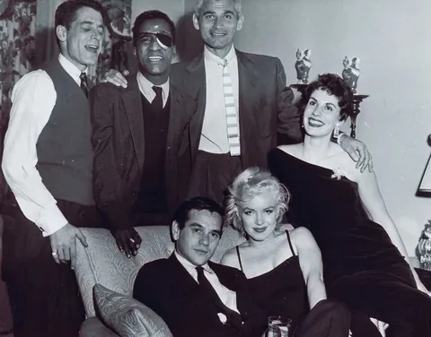 Sammy Davis Jr throws a party (1954). Sammy had just lost his eye in a car accident and had to wear an eyepatch, so others joined in. You may recognize some other famous faces.