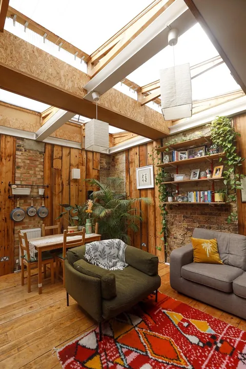 My cozy garden flat in London, featuring my fuzzy friend who slept on the roof