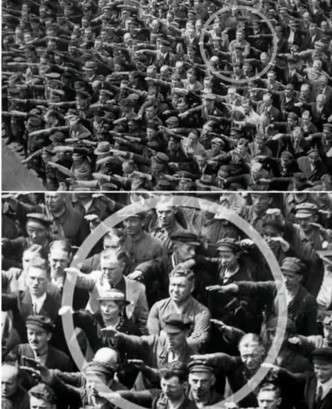 In 1936, during a Nazi rally in Hamburg, a single man stood out in a sea of raised arms refusing to perform the Nazi salute. That man was later identified as August Landmesser.