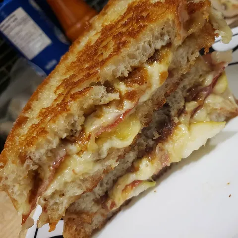 Incredible grilled cheese on homemade bread. With crispy prosciutto, pear, caramelized onion, fig jam,.and roasted garlic.