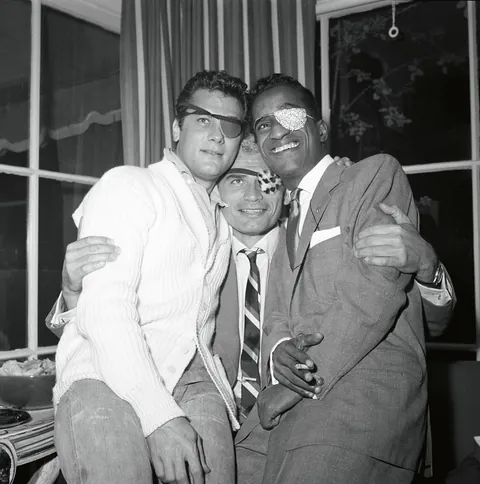 Sammy Davis Jr throws a party (1954). Sammy had just lost his eye in a car accident and had to wear an eyepatch, so others joined in. You may recognize some other famous faces.