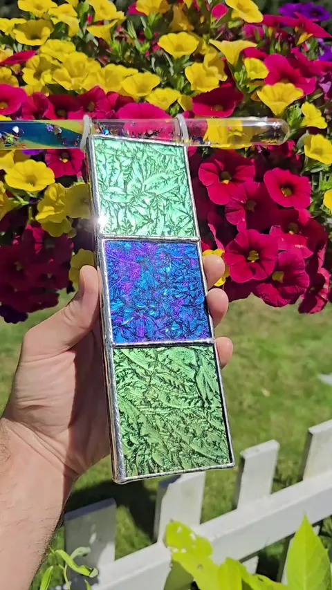 Watching sunlight dance through my latest kaleidoscope creation.