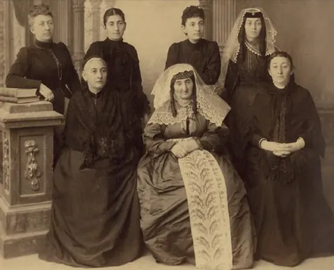 My 3rd great grandmother with her 12 children. Late 1870s