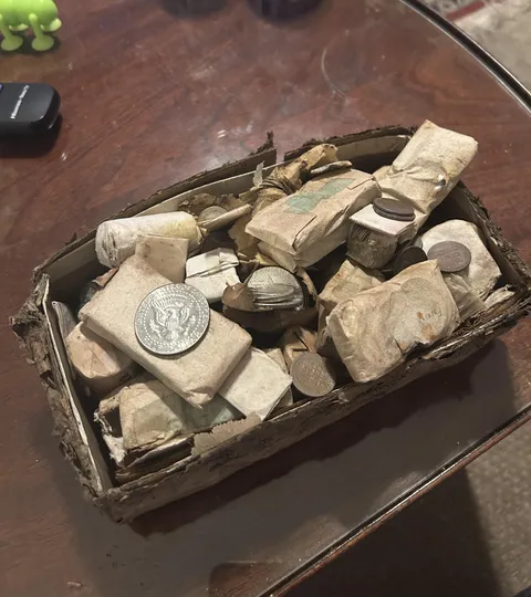 I found a fake brick in my garage containing a load of coins hidden by the previous owner