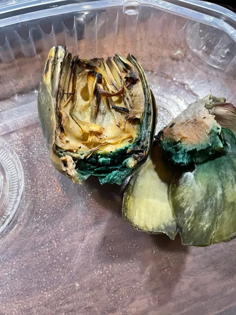 Ordered takeout and this is how all of my artichokes came. Before I ask the restaurant "WTF?", is this WTF worthy or are teal artichokes a thing?
