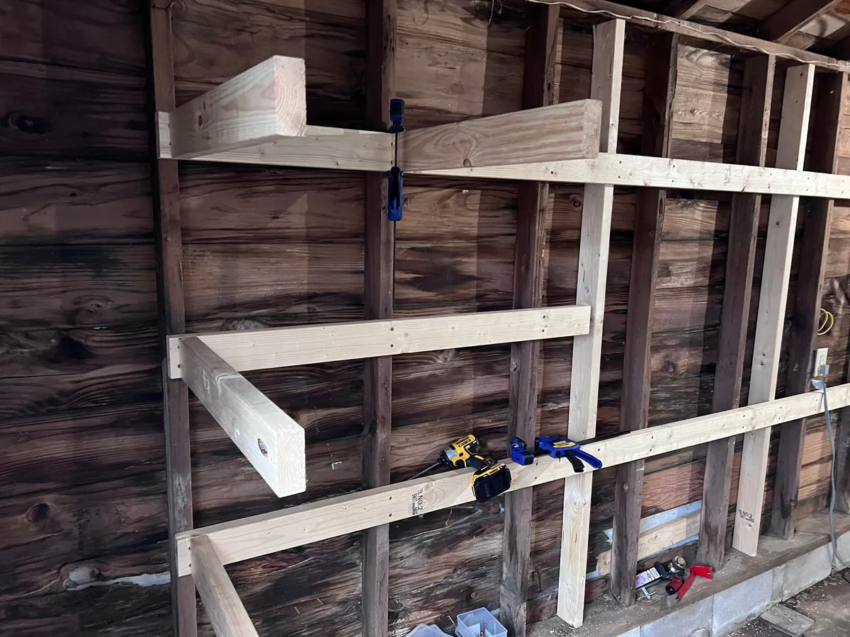 Completed a weekend project! Shelves and a workbench built into my garage.