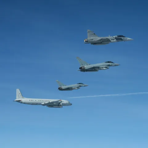 Swedish Airforce JAS-39C Gripen and German Airforce Eurofighter Typhoon aircraft monitoring a Russian IL-20 reconnaissance aircraft over the Baltics, September 21 2025.