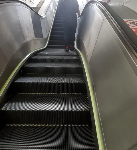 This escalator has a small landing half way up 