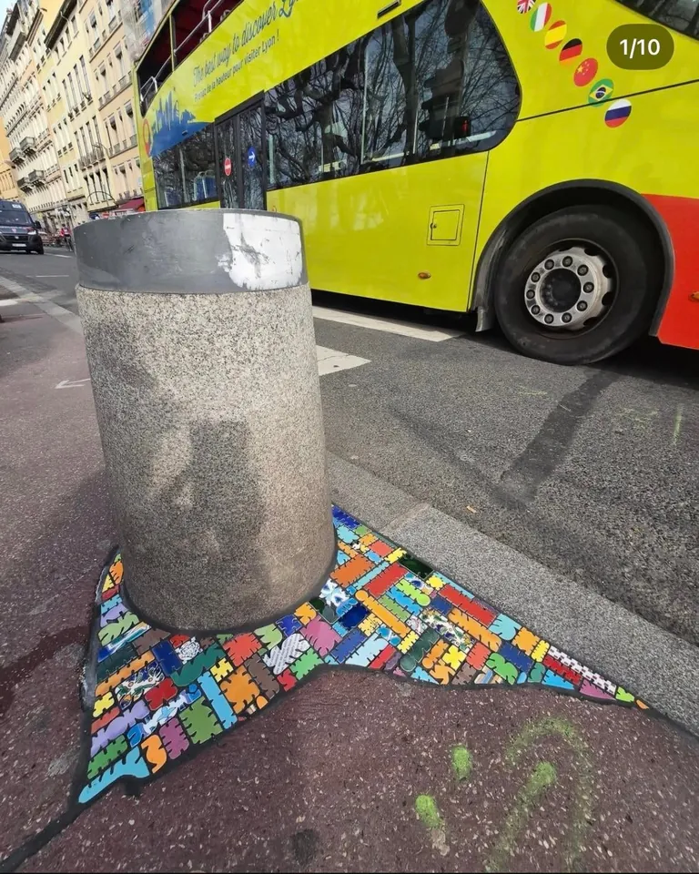 French Artist “EmEmEm”paves cracks and holes with mosaics. This is also known as “Flacking”.