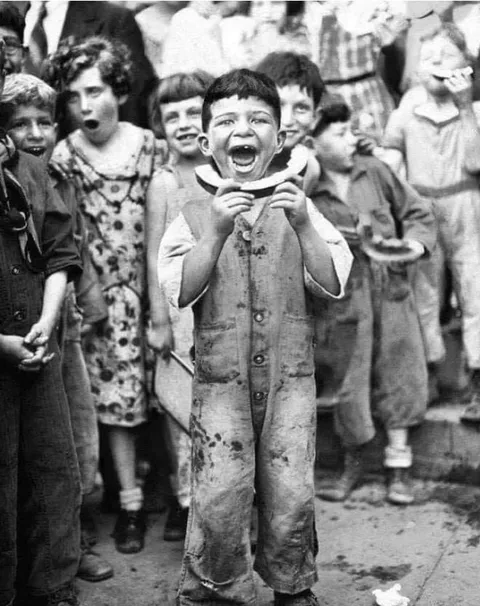 The champion watermelon eater at the 4th of July celebration in Brooklyn, 1935.