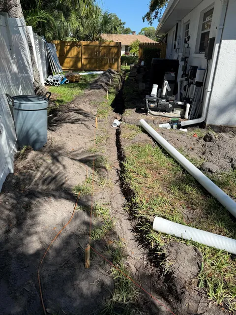 Hurricanes kept flooding my backyard so I buried 140ft of drainage pipe to prevent it.