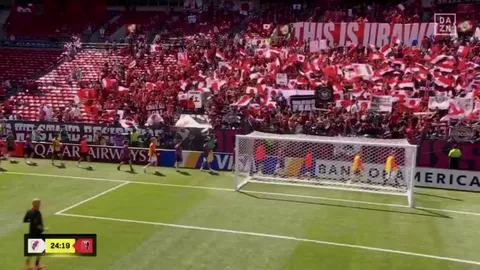 Urawa Red Diamonds players greet their fans with a spectacular gesture before the match