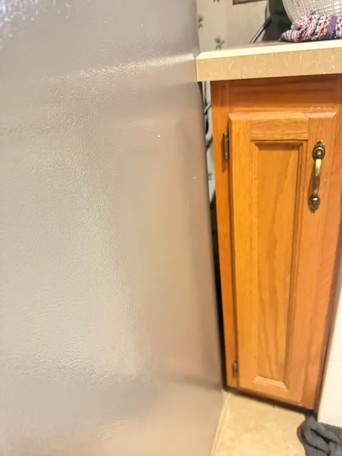 How would you guys go about getting this fridge to fit, it is VERY close.