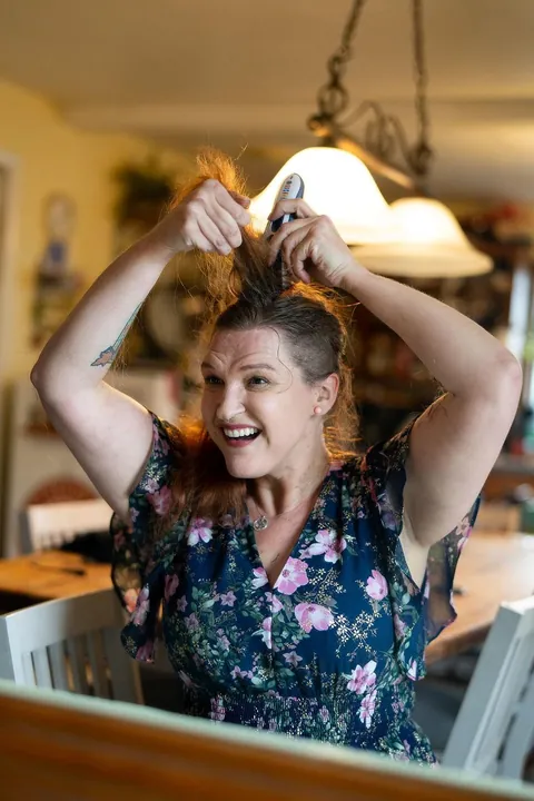 Shaving my head after week one of chemo