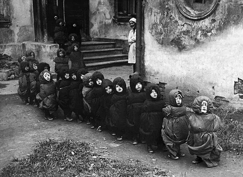Soviet children in sleeping bags on the way to their dorm room, 1930