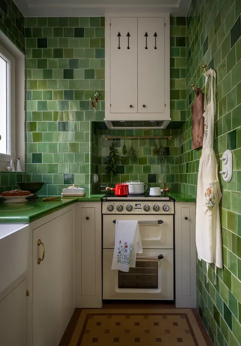 Green tile-clad compact kitchen renovation in a 550 sq ft apartment in the 14th arrondissement of Paris, France [1200x1725]