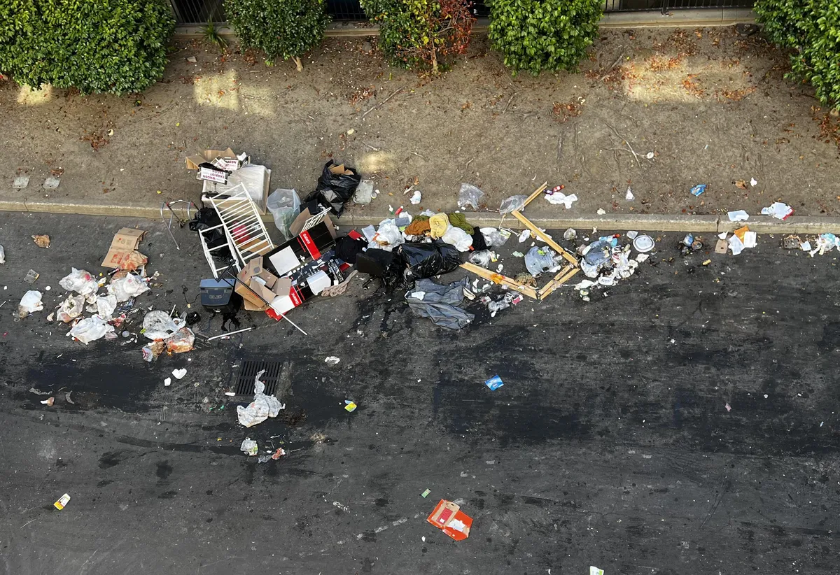 3 people in a U-Haul just pulled up and threw all their junk onto the alley behind my apartment and took off.