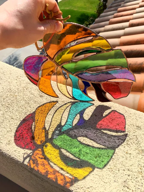 I combined my love of plants and stained glass into a rainbow monstera leaf sun-catcher!