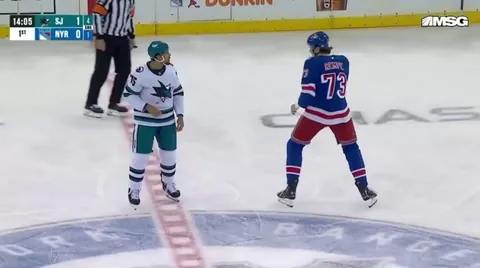 Sharks 6'1" Ryan Reaves takes on Rangers 6'9" Matt Rempe in the first period of today's game