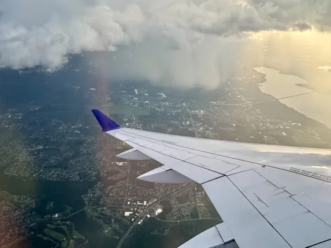Flight was delayed due to lightning &amp; microburst storm. After takeoff we had to bank hard around it